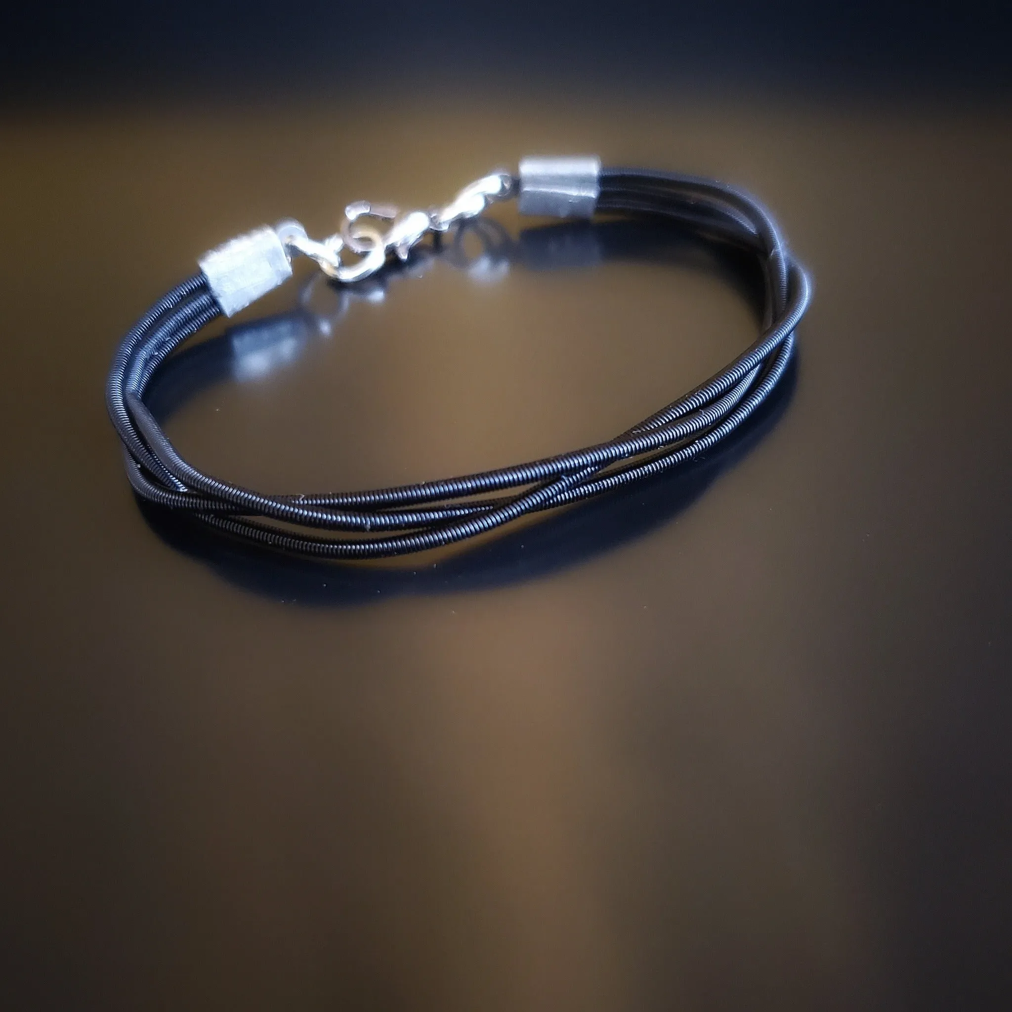 Black braided Harp String Clasp Style Bracelet