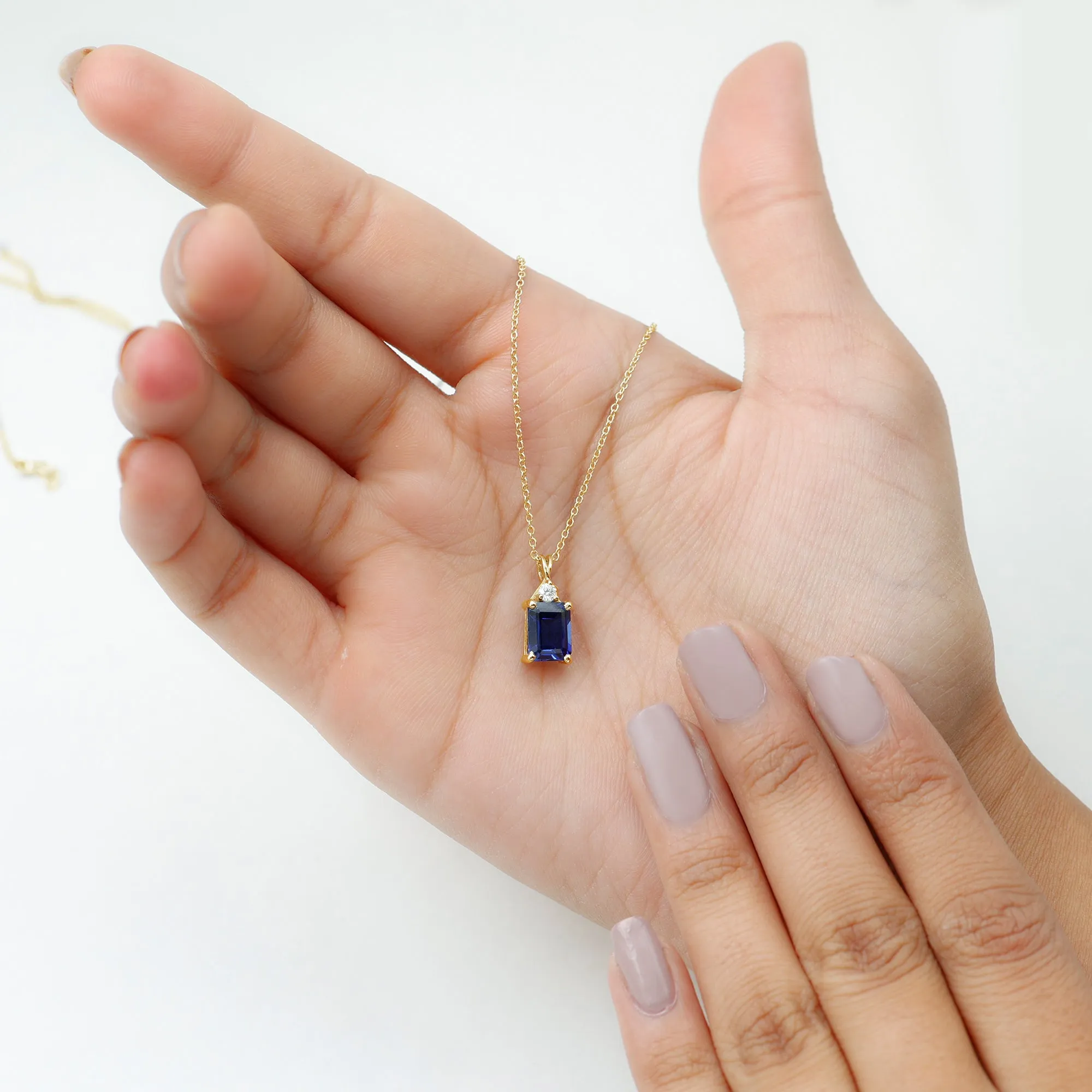 Emerald Cut Created Blue Sapphire Solitaire Pendant with Moissanite