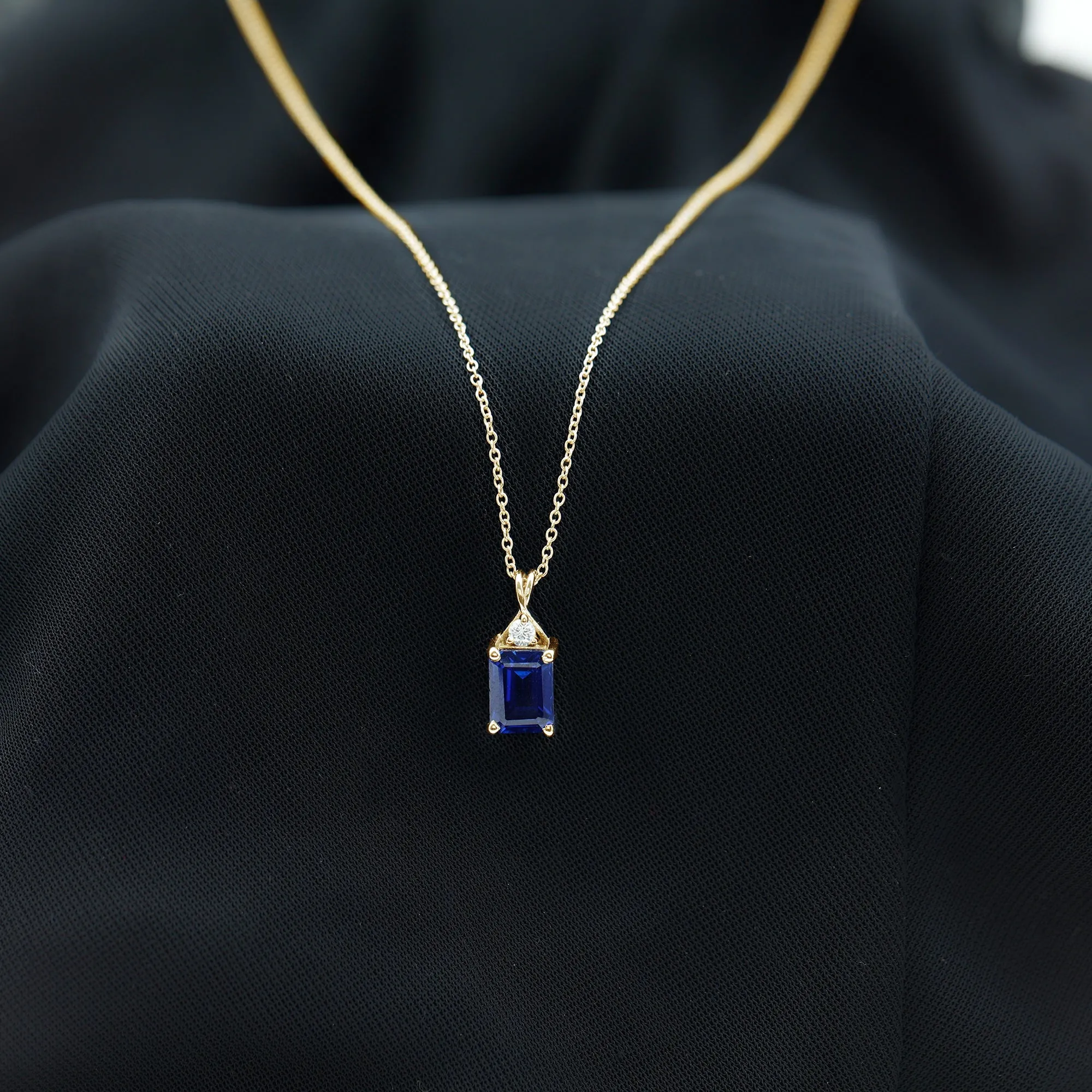 Emerald Cut Created Blue Sapphire Solitaire Pendant with Moissanite