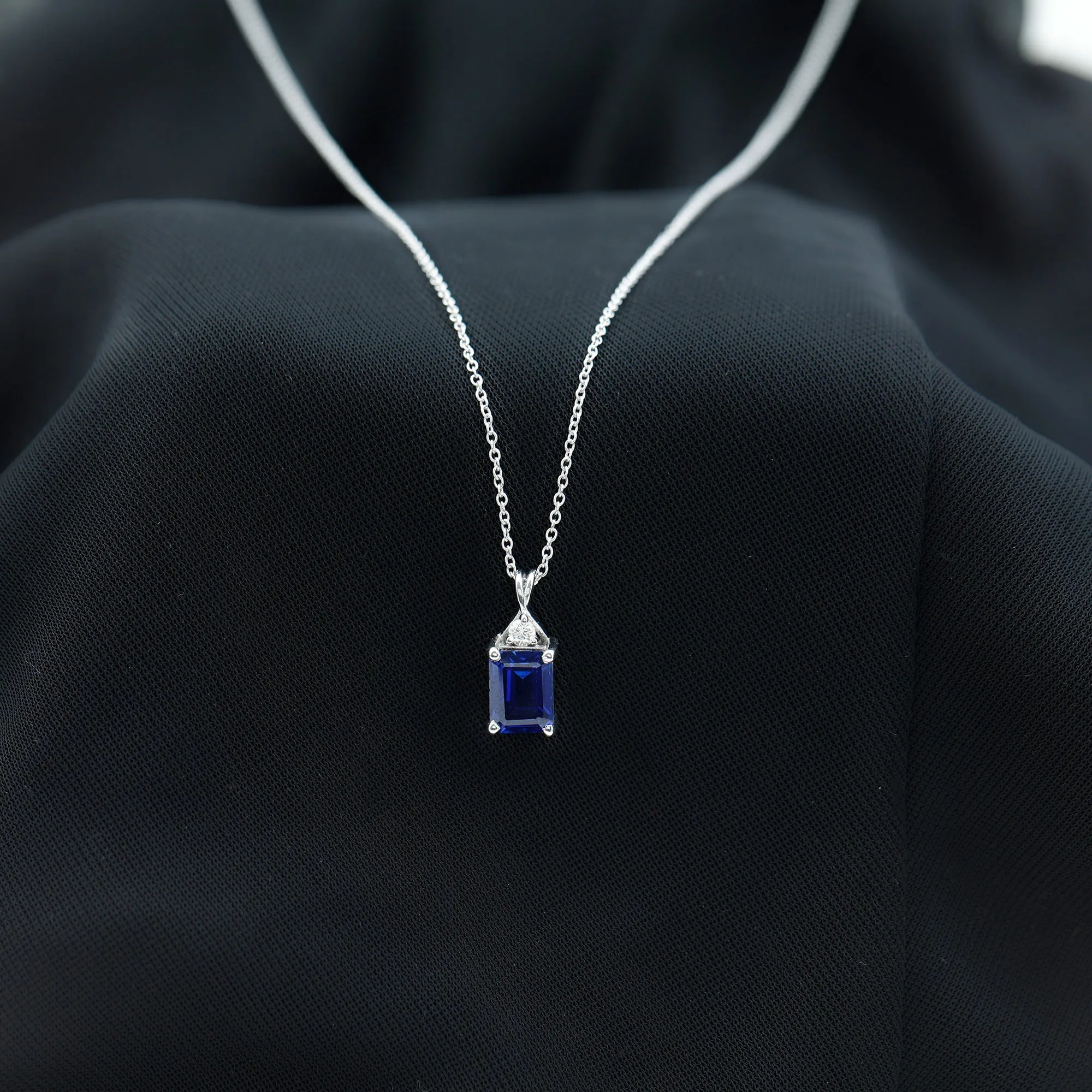 Emerald Cut Created Blue Sapphire Solitaire Pendant with Moissanite