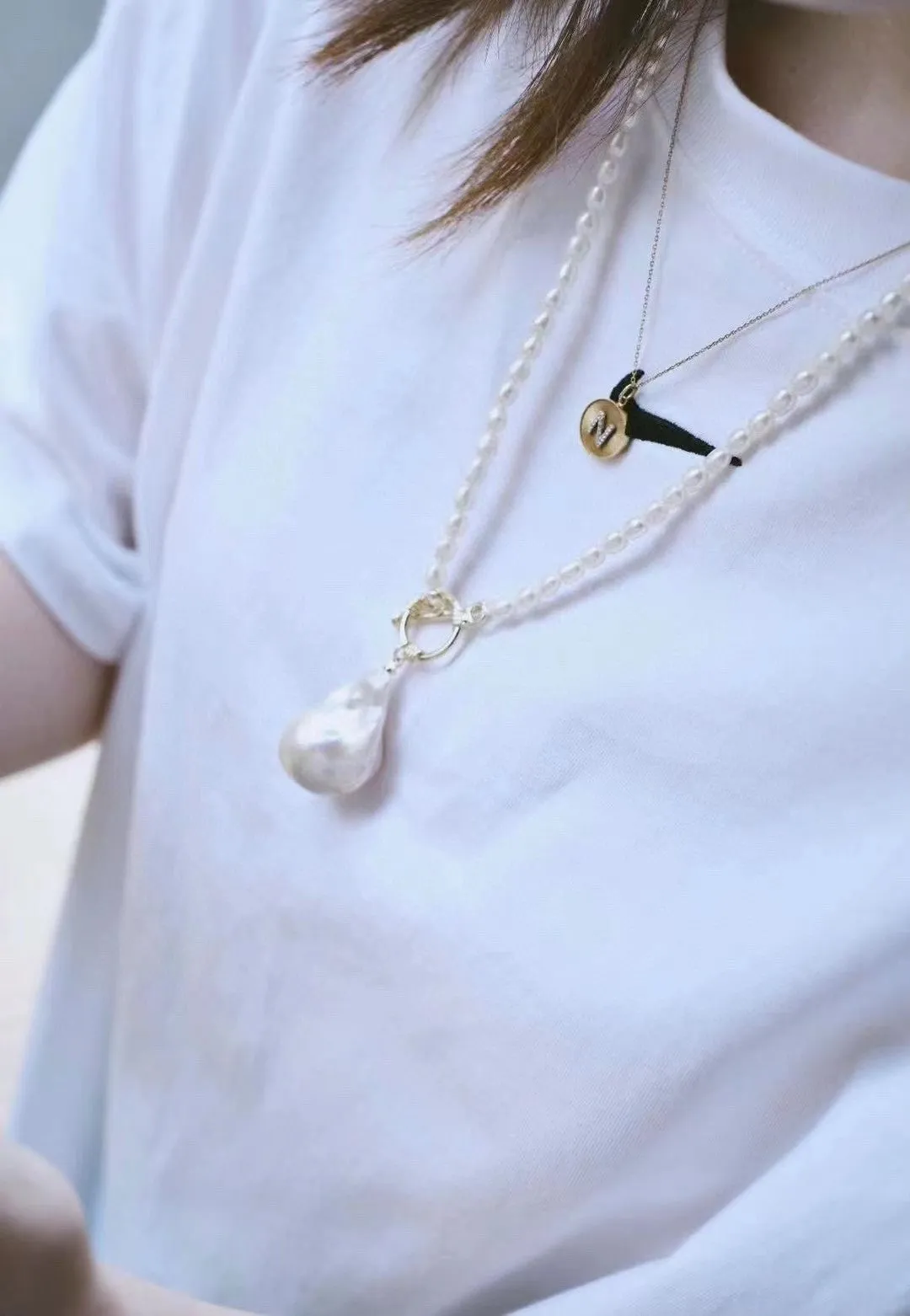 Natural pearl necklace with unique baroque pendant